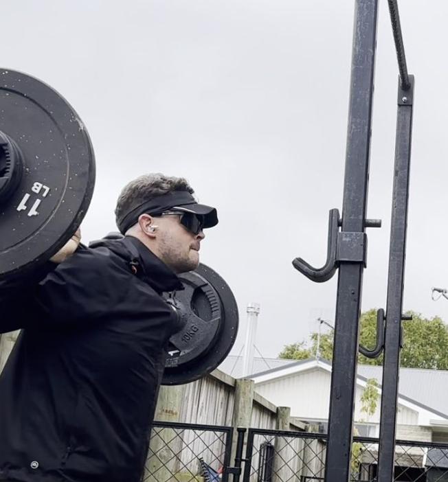 Barbell work in a backyard gym
